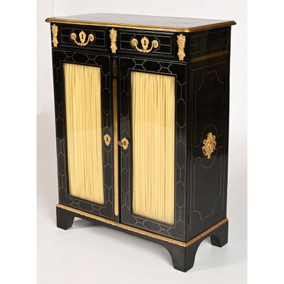 null REGENCE LEAF LIBRARY in blackened wood with geometric brass fillet inlays. It...