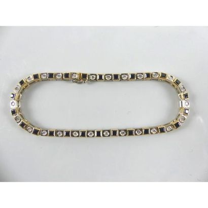 null Bracelet ligne 2 ors 750°/°° serti clos de saphirs intercalés de diamants en...