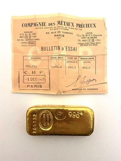 null A gold bar number 765732. Gold title weight 996.4g. Stamp of the company of...