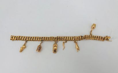 null American link bracelet in 18 K yellow gold, with charms, some in gilded metal...