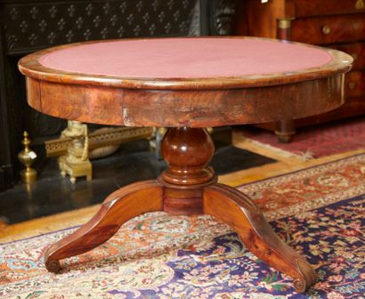 null Large pedestal table in wood, mahogany and flamed veneer. Circular top upholstered...