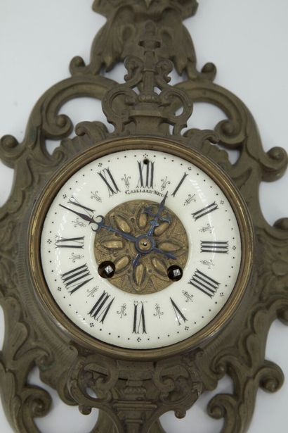 null Chased bronze wall clock decorated with mascarons, fire pots and foliage, white...