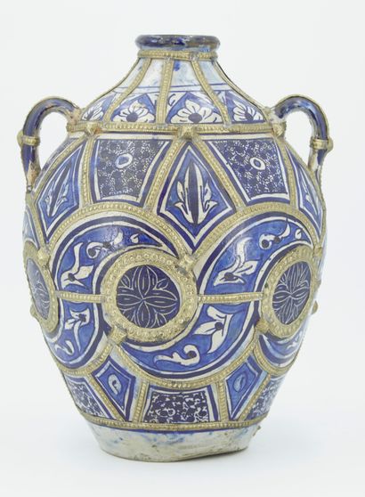 null Vase with large body and narrow neck in blue and white enamelled clay with compartmentalized...