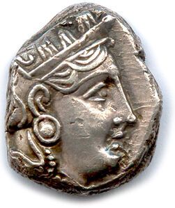 null ATTICA - ATHENS 338-329

Helmeted head of Athena, eye in profile. R/. Owl. Olive...