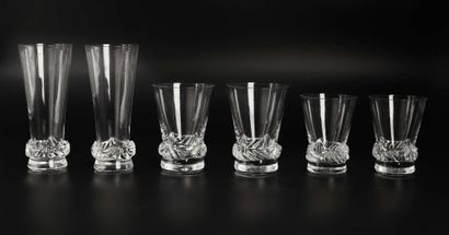 null DAUM. 

Set of pressed molded glasses model SORCY including: 

- 11 flutes

-...