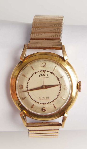 null YANIK.

Watch with gold case 750/1000e

Round dial with horn.

Gold-plated bracelet...