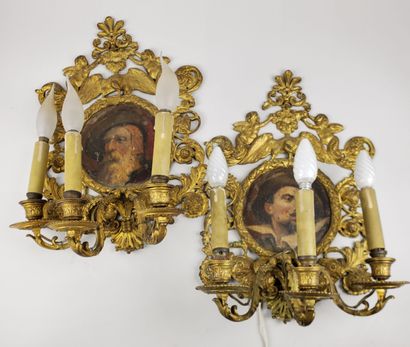null Pair of electrified three-light bronze wall sconces decorated with putti, eagles...
