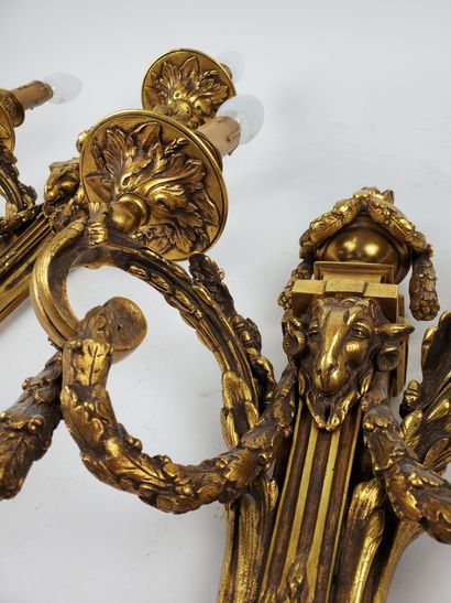null Pair of Louis XVI style sconces in gilt and chased bronze, two arms of light,...