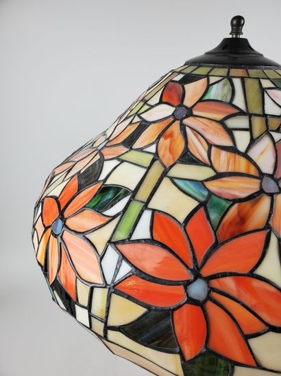 null In the taste of TIFFANY
Table lamp, stained-glass polychrome lampshade featuring...