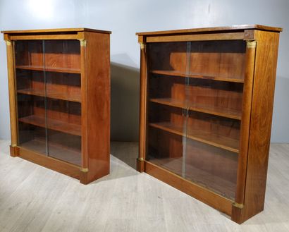 null Pair of Empire-style mahogany veneered display cabinets, with two detached columns...