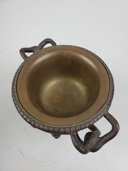 null CUP "Warwick" in bronze with brown patina, decorated with antique heads, with...
