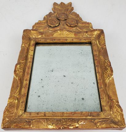 null MIRROR, carved and gilded wood frame, pediment decorated with three flower buds,...