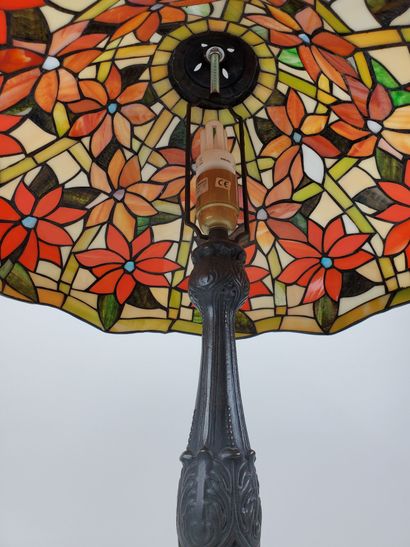 null In the taste of TIFFANY
Table lamp, stained-glass polychrome lampshade featuring...