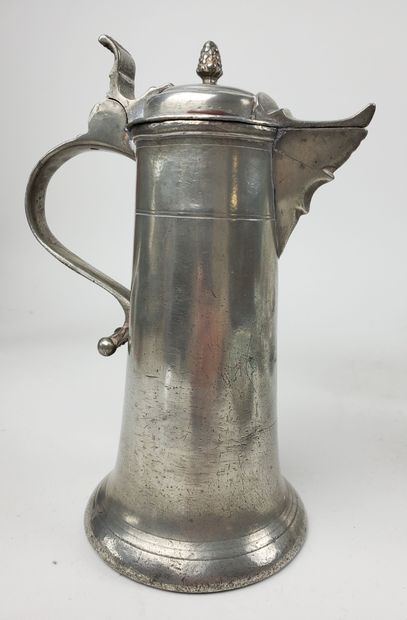 null Pewter pitcher. Moulded palmette handle, domed lid with fretel.
18th century
Height:...
