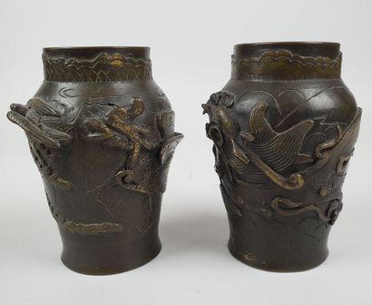 null JAPAN - Circa 1900
Pair of bronze vases with brown patina, decorated in relief...