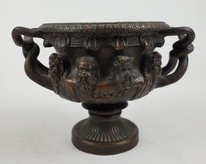 null CUP "Warwick" in bronze with brown patina, decorated with antique heads, with...