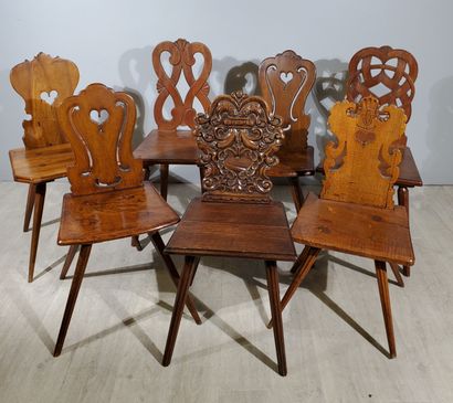null SEVEN ALSACIAN CHAIRS with openwork back and divergent legs 
Dimension of largest:...