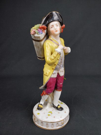 null "Man with flower basket
Polychrome porcelain subject 
Marked under the base
Height...