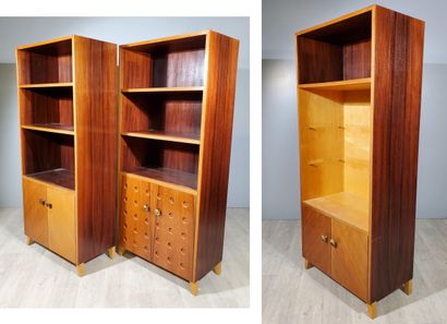 null Three-module LIBRARY in teak veneer, two of which feature a niche with two shelves...
