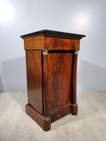 null Empire-style bedside table in flamed mahogany veneer, topped with white-veined...