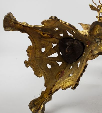 null Gilt bronze CANDELABER
Embossed and chased, decorated with flowering amaryllis...