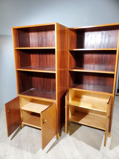 null Three-module LIBRARY in teak veneer, two of which feature a niche with two shelves...