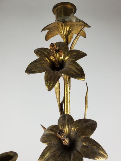 null Gilt bronze CANDELABER
Embossed and chased, decorated with flowering amaryllis...