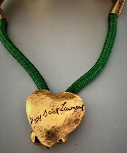 null YVES SAINT LAURENT Bracelet réglable en cordionnet vert et motifs en métal doré...