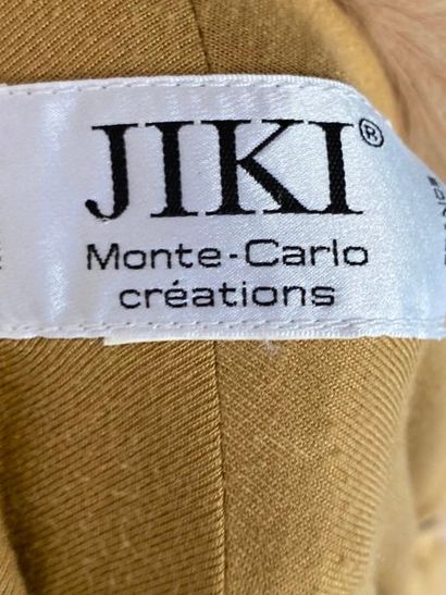 null JIKI Monte Carlo Creations Cream jersey jacket with draped back and fox trim...