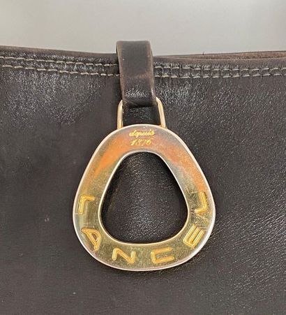 null LANCEL Black leather messenger bag with shoulder strap and golden metal ring...