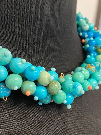 null Attributed to CHANEL by GRIPOIX Strung on a braid of turquoise glass paste beads...