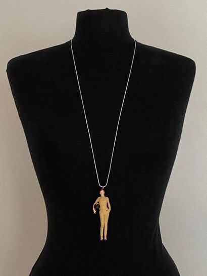 null CHANEL Long snake chain metal necklace holding a "biker" figurine in chanelized...