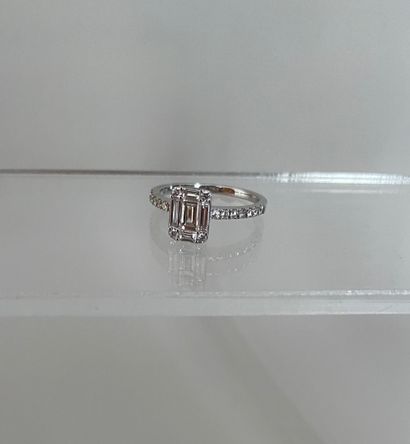 null 750 thousandths white gold ring set with a rectangular diamond framed with round...