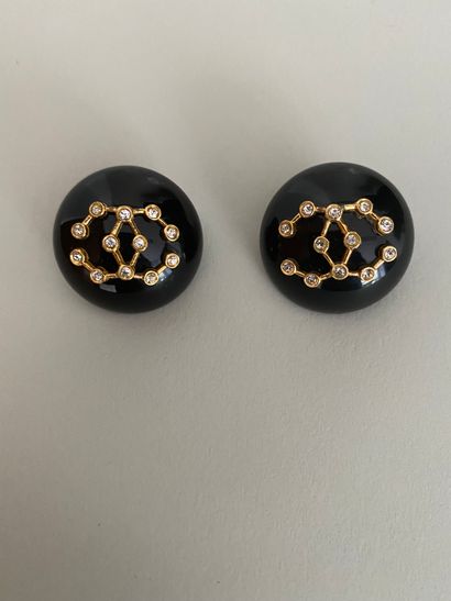null CHANEL Pair of black bakelite ear clips with gold metal and rhinestones - unsigned...