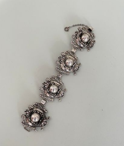 null CINI Bracelet en argent 925 milièmes composé de 4 motifs baroques feuillagés...