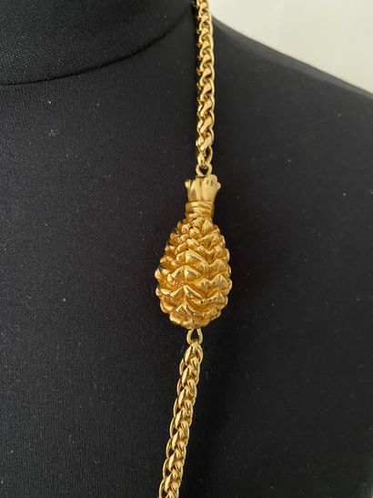 null Long necklace in gilded metal with pineapple motif and wicker basket signed...