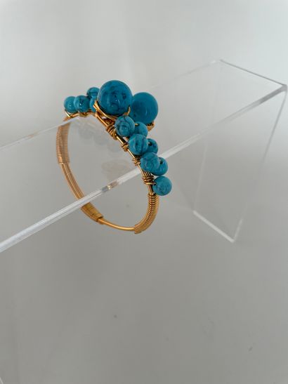 null Crossed bracelet made of golden metal threads and turquoise beads - unsigned...