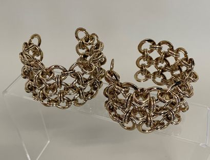 null Pair of gilded metal cuff bracelets with rings connected by a double mobile...