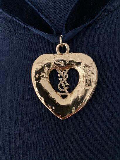 null 
YVES SAINT LAURENT by ROBERT GOOSSENS Heart pendant with the brand's logo in...