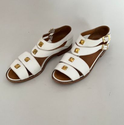 null HERMES Paris Pair of white leather straps sandals with gold metal studs and...
