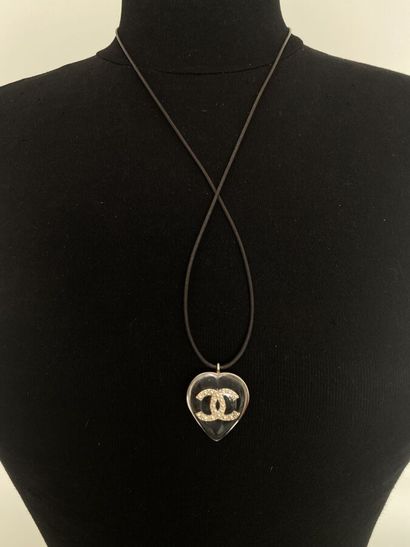 null CHANEL Silver plated metal and plexi heart pendant with double C pearl inclusion...