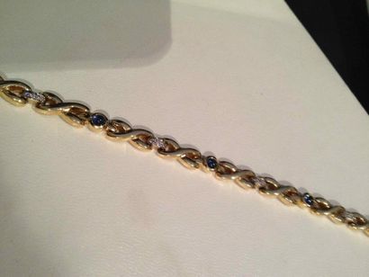 WEMPE 1999 Bracelet Liens en or alterné de petits motifs diamant et saphir cabochon...
