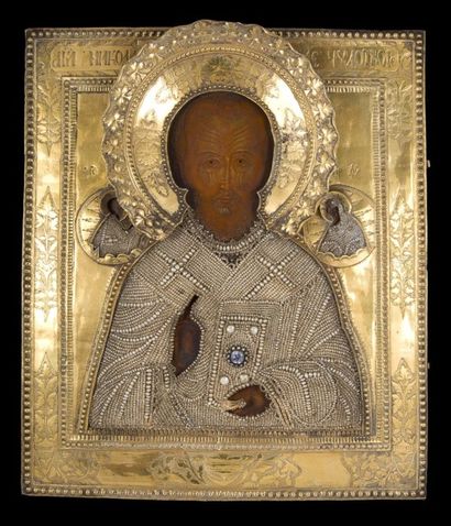 null Icone représentant Saint Nicolas en bois et argent doré recouvert d'une rizza...