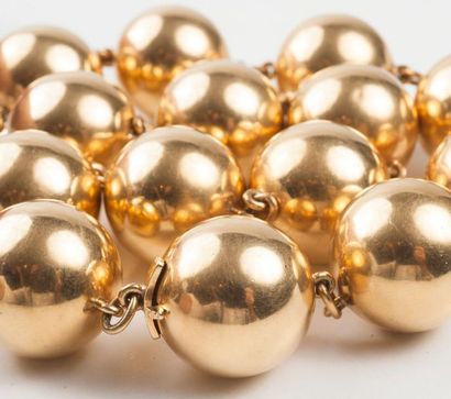 null Collier à transformations formant deux bracelets composés de 14 sphères en or...