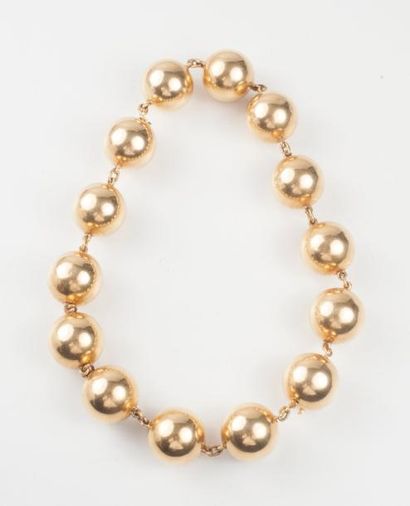 null Collier à transformations formant deux bracelets composés de 14 sphères en or...