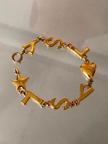 null YVES SAINT LAURENT 

Bracelet gourmette en métal doré composé des initiales...