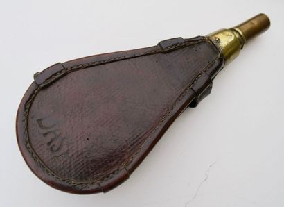 null Officer's powder flask. Wooden body covered with embossed leather with gilded...