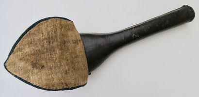 null Cast iron for gun. Wood covered with leather with a blue cloth cover bordered...