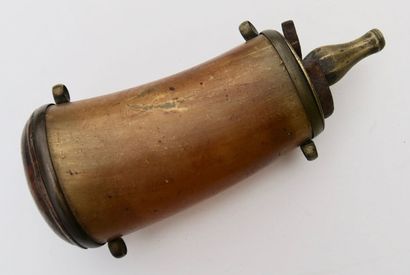 null Powder flask in cow horn with faceted brass measuring spout. On the bottom is...