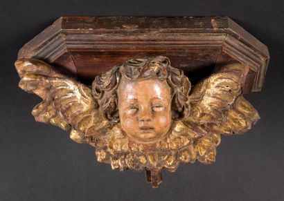 null Sculpture en bois doré et polychrome représentant une tête d'ange joufflu.
XVIIIe
H...